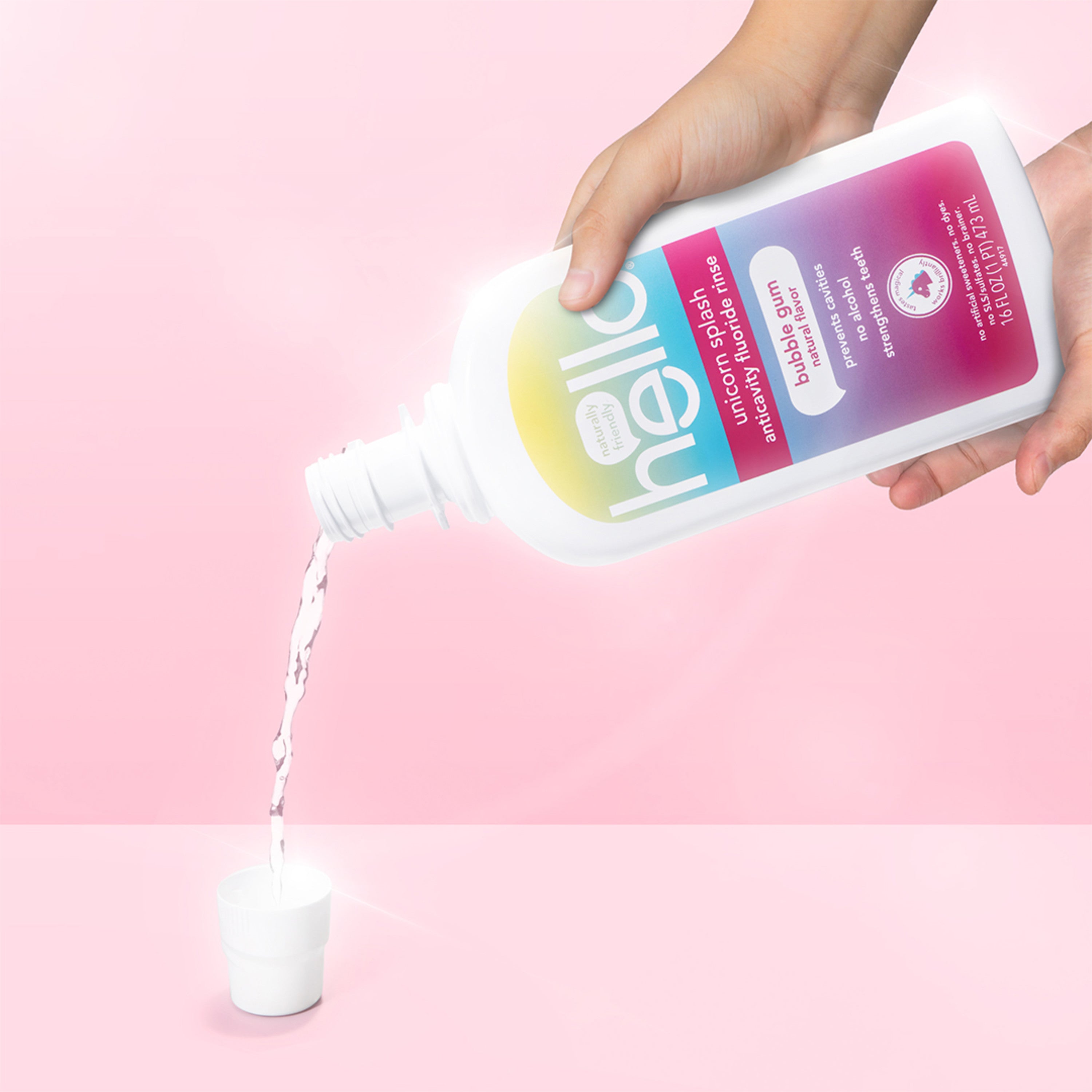 kids unicorn splash fluoride mouthwash, being poured out