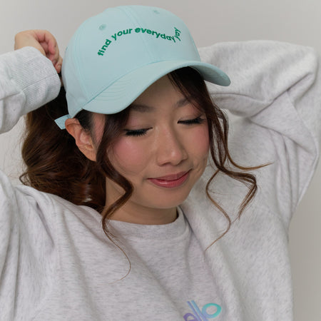 A woman wearing a green 