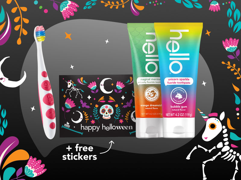 Hello toothpaste tube, toothbrush, and Halloween-themed packaging on a colorful background with Halloween elements.