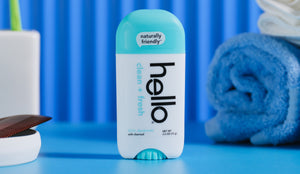 Bottle of 'hello' deodorant in clean + fresh with a blue background